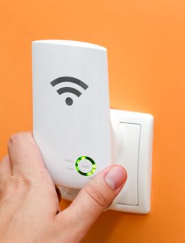 Wifi,Repeater,In,Electrical,Socket,On,Orange,Wall.,Simply,Way
